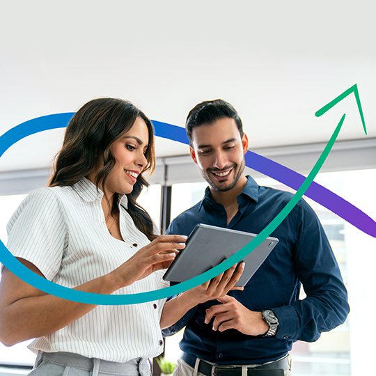 Latin American business people sharing ideas at the office while using a digital tablet - people at work concepts